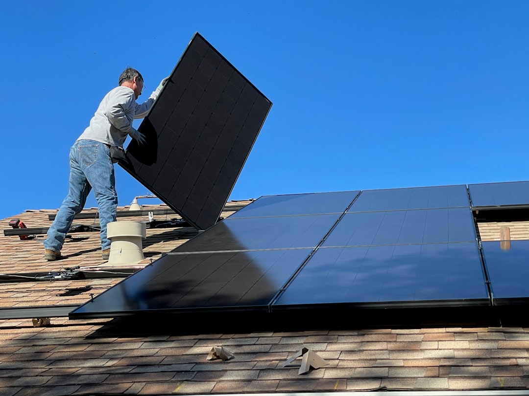 Person installing solar panel
